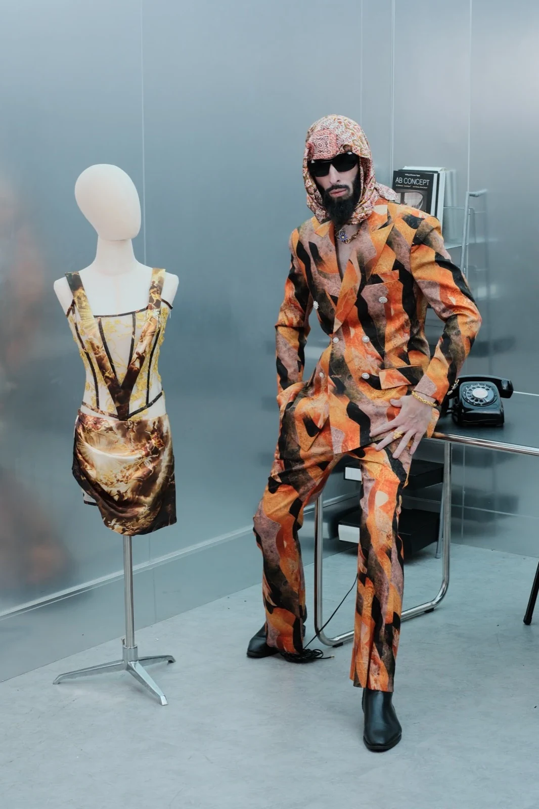 Menswear look photographed in a Singapore atrium
