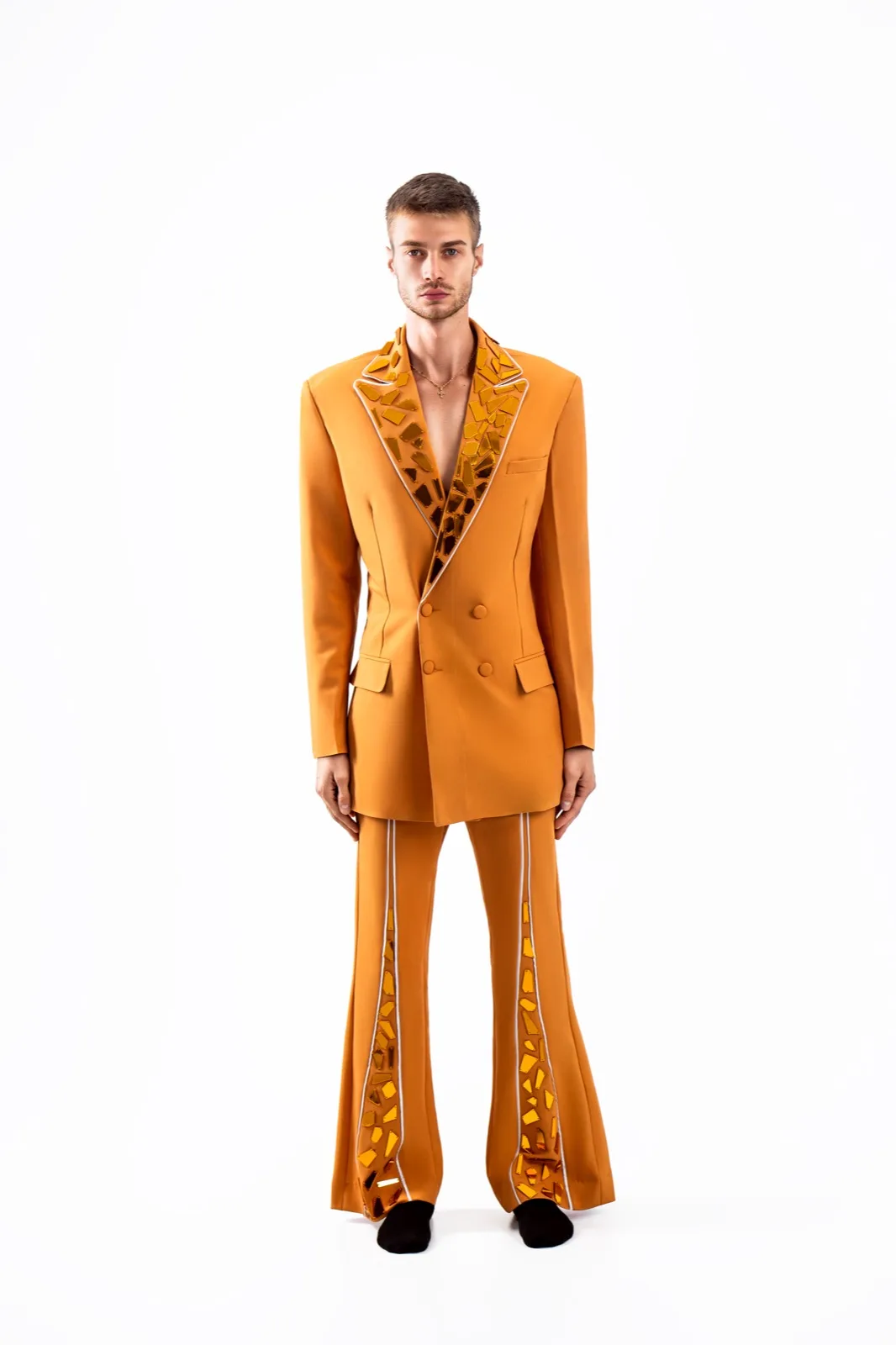 Couture menswear suiting in burnt orange mosaic print