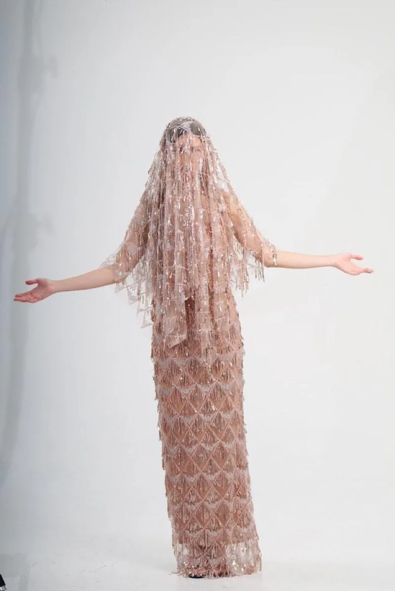 Beaded gown with matching veil — bridal-adjacent